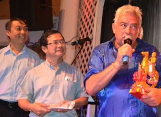 Johnny presented a donation to Father Peter and Father Michael of the Father Ray Foundation.